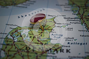 Aalborg pinned on a map with the flag of Denmark