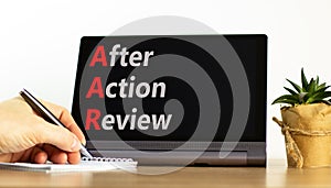 AAR After action review symbol. Concept words AAR After action review on beautiful black tablet. Beautiful white background.