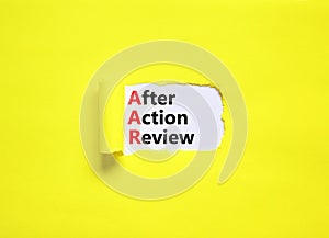 AAR After action review symbol. Concept words AAR After action review on beautiful white paper. Beautiful yellow paper background