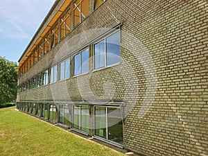 Aarhus University campus, facade with yellow bricks and awnings