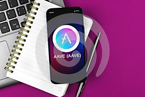 AAVE symbol. Trade with cryptocurrency, digital and virtual money, banking with mobile phone concept. Business workspace