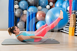 Ab exercise woman swiss ball leg lifts Pilates