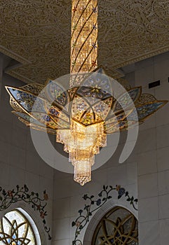 AbAbu Dhabi, UAE - 11.27.2022 - Chandelier inside of a Sheikh Zayed grand mosque, largest mosque in the country. Religion