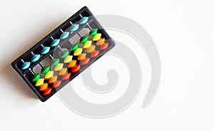 Abacus with colored beads, toy to learn counting, text and copy space