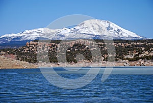 Abajo Mountains and winter lake in Utah photo