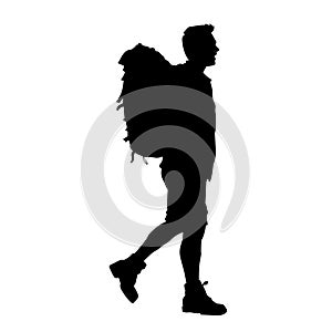 silhouette of a backpaker tourist or traveler walking. photo