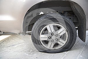 Abandon car with flat tire and tire burst from accident on the road