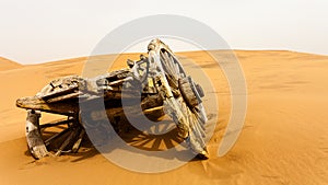 Abandon wooden cart in the desert