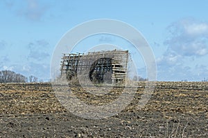 An Abandonded Corn Crib in a Field