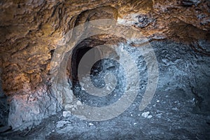 Abandoned adit interior, dark tunnel of old magnesium mine