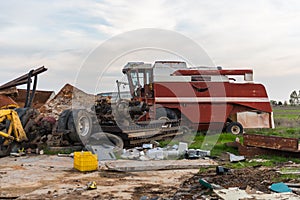 Abandoned agricultural machinery in a scrap yard