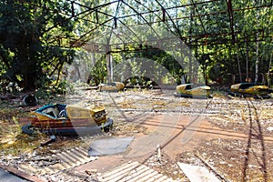 Abandoned Amusement Car Ride in park of attractions in Ghost City of Pripyat in Chernobyl Exclusion Zone