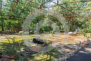 Abandoned Amusement Car Ride in park of attractions in Ghost City of Pripyat in Chernobyl Exclusion Zone