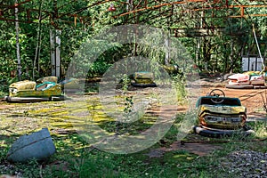 Abandoned Amusement Car Ride in park of attractions in Ghost City of Pripyat in Chernobyl Exclusion Zone