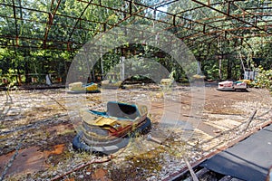 Abandoned Amusement Car Ride in park of attractions in Ghost City of Pripyat in Chernobyl Exclusion Zone