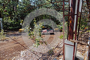 Abandoned Amusement Car Ride in park of attractions in Ghost City of Pripyat in Chernobyl Exclusion Zone