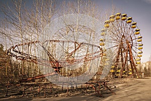 Abandoned amusement park in Pripyat, in Chernobyl Exclusion Zone, Ukraine photo