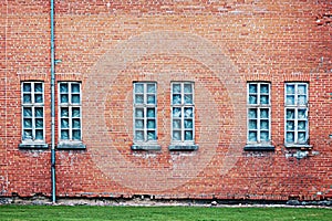 Abandoned architecture background with brick wall and windows