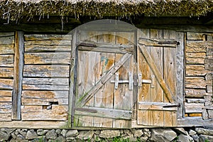 Abandoned barn vintage wooden door. Photo of rustic house entrance