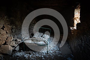 Abandoned bedroom of a house with old forgotten beds.