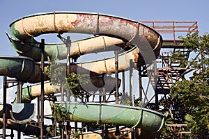 An abandoned big old water slide in the Mamaia, Romania photo