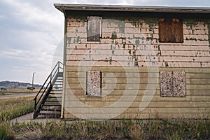 Abandoned boarded up bunkhouse or hotel building in the ghost town of Jeffrey City Wyoming