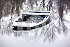 Abandoned boat frozen in a lake