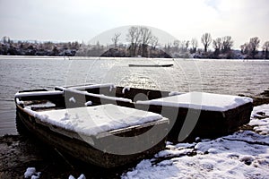 Abandoned boat frozen in a lake