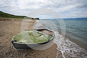 Abandoned boat on sand, Baikal lake coast, Olkhon. photo