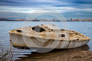 Abandoned Boat on the Shores of Mar Menor, La Manga, Spain photo