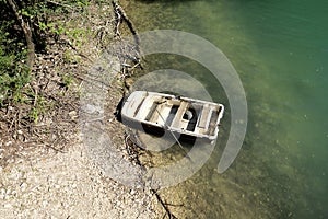 abandoned boat sunk in the lake