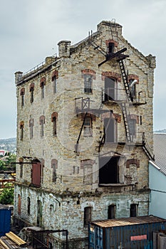 Abandoned brick industrial building Former elevator of factory of baked goods, Novorossiysk, Russia