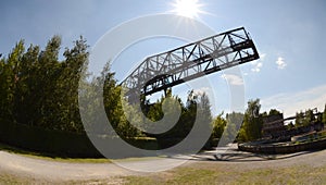 Abandoned bridge crane in the sunshine