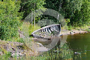 Abandoned broken boat on the river