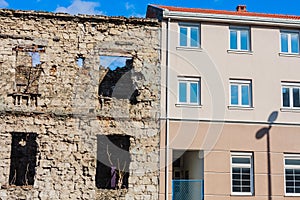 Abandoned building, detroyed during Bosnian War at Bulevar Street in Mostar city, Bosnia and Herzegovina photo