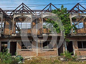 Abandoned building by front perspective of unfinished house with degenerate structure