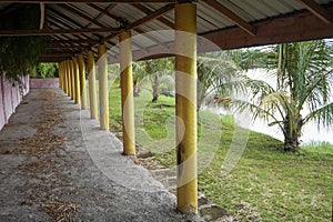 Abandoned building golden pillars in the middle of nature