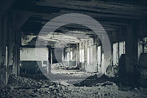 Abandoned building interior, ruins of industrial factory, spooky scary dark corridor, horror scene