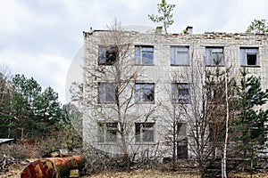 An abandoned building overgrown with trees in Pripyat