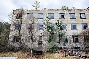 An abandoned building overgrown with trees in Pripyat