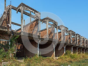Abandoned building by side perspective of unfinished house with degenerate structure detail