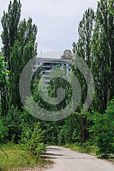 Abandoned building with the Soviet Union coat of arms in ghost town Pripyat Chornobyl Zone photo