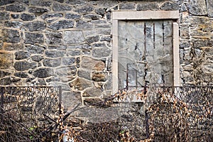 Abandoned building stone wall window