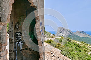 Abandoned building at Talaia d'Albercutx watchtower, Cap de Formentor in the background. Majorca, Spain. photo