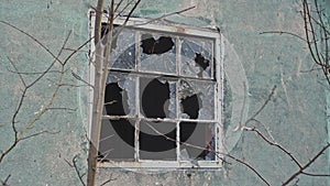 Abandoned Building Window with Pieces of Shattered Glass