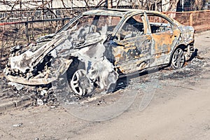 Abandoned and burnt-out car.