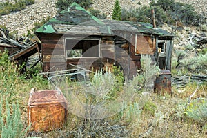 Abandoned Cabin and Rusty Refrigerator in Bayhorse Ghost Town, Idaho, USA