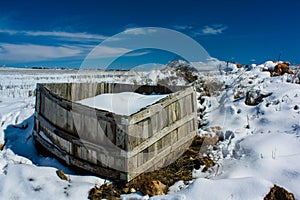 Abandoned caisson covered with snow photo