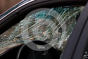 Abandoned car with broken windshield