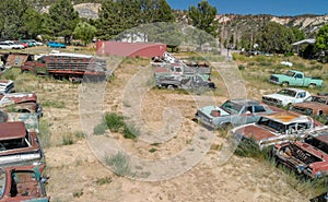 Abandoned car parking with old vintage cars wreckages